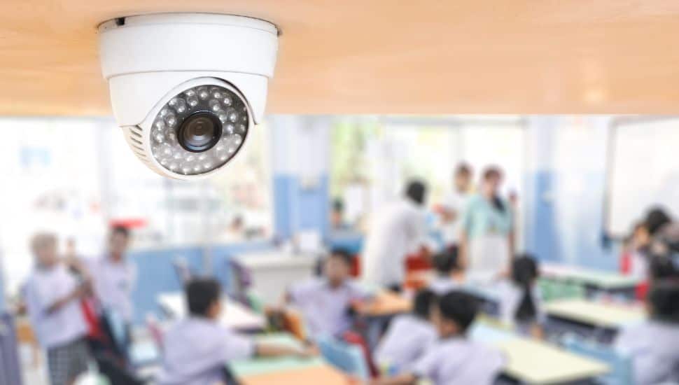 CCTV Security monitoring student in classroom at school.Security camera surveillance for watching and protect group of children while studying.