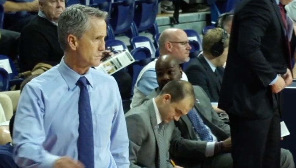 Steve Donahue walks the sideline at a basketball game.