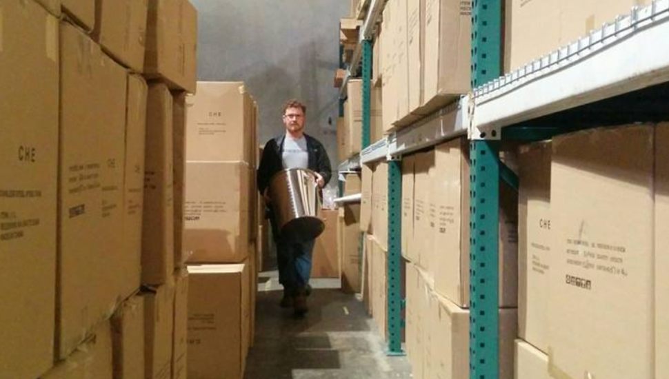 Steve Schnarr is walking through an aisle of inventory.