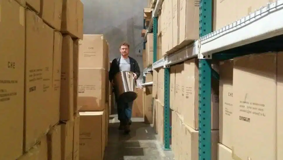Steve Schnarr is walking through an aisle of inventory.