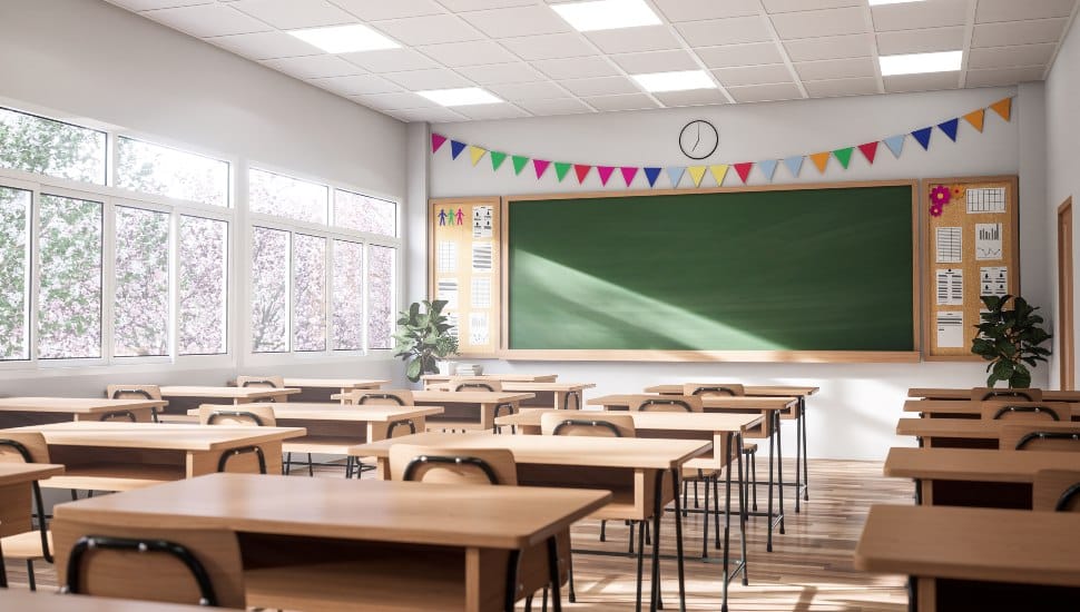 Empty elementary school classroom with chalk board.
