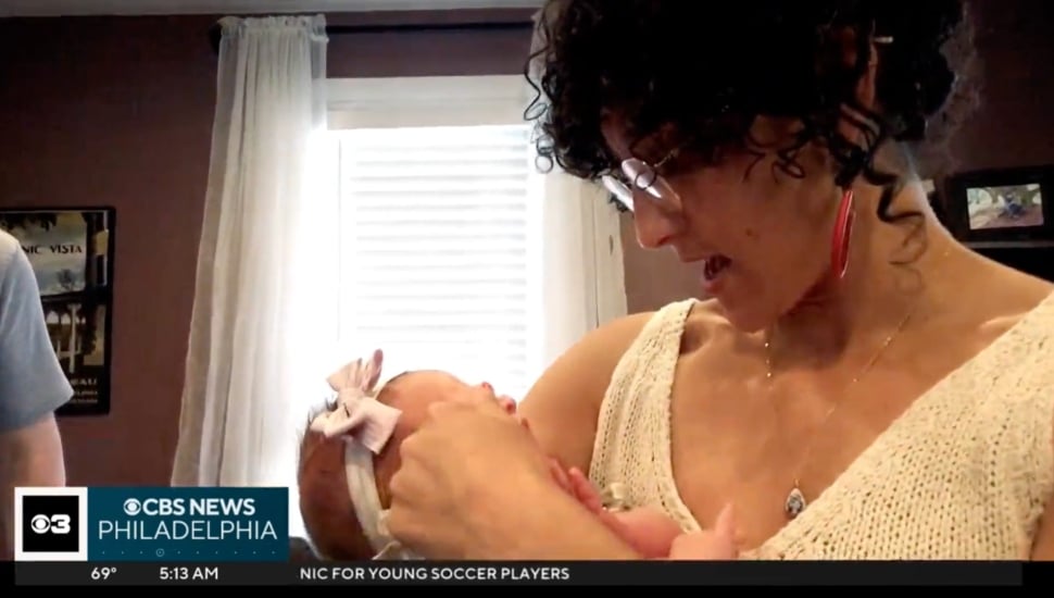 Elizabeth Weinstein holds Mary and Marissa's baby.