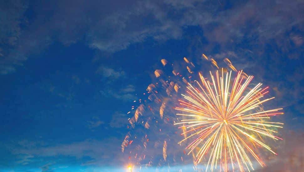 Fireworks exploding in the night sky.