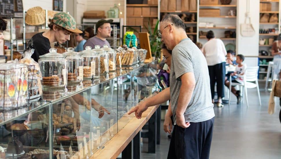 Customers inside Malvern Buttery ordering food and standing.