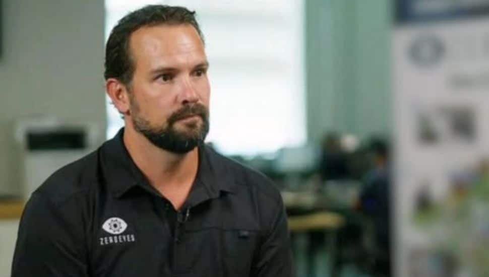 Mike Lahiff wears a black ZeroEyes polo.