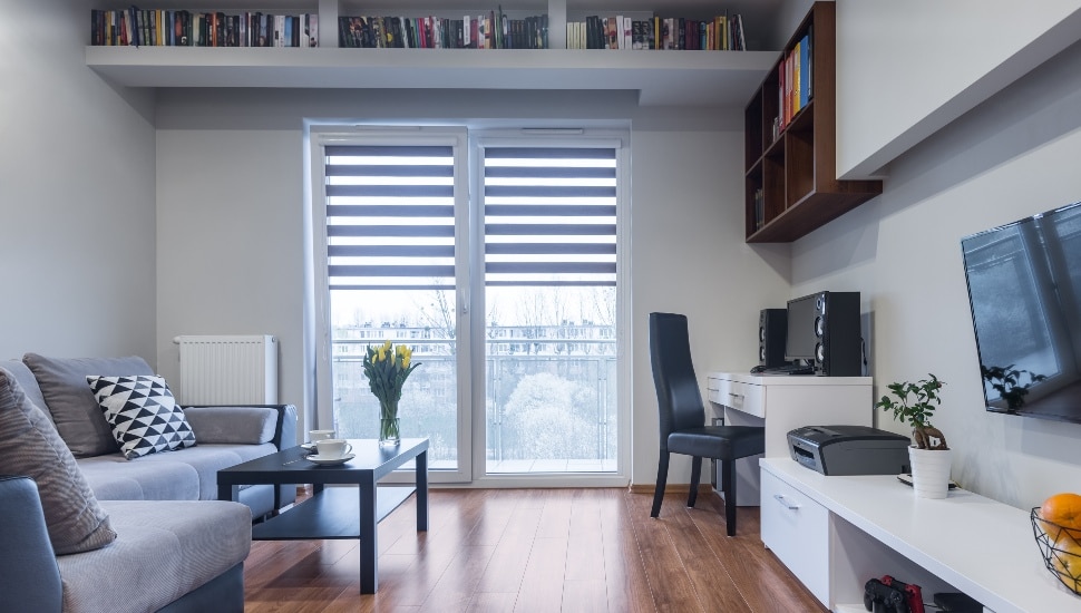 New design home interior with window, TV, large sofa and white furniture set.