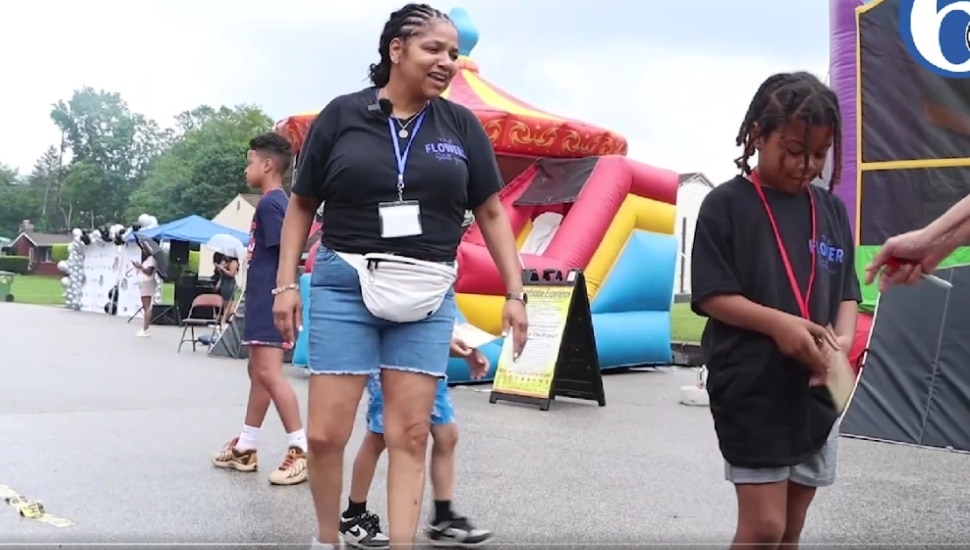Renee Sherman and a young child at the 11th annual "The Flowers Still Grow" festival.