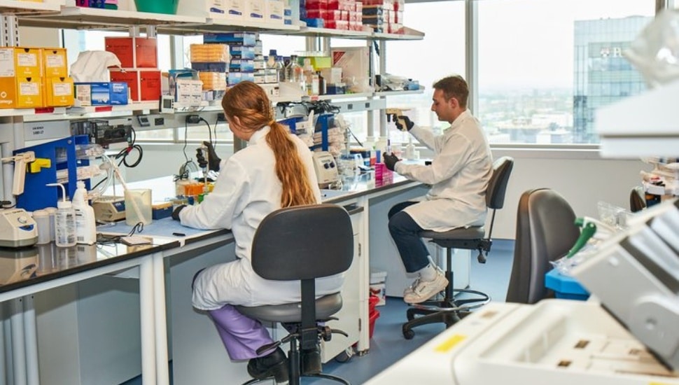 Scientists inside lab of HIV Cure and Viral Diseases Center.
