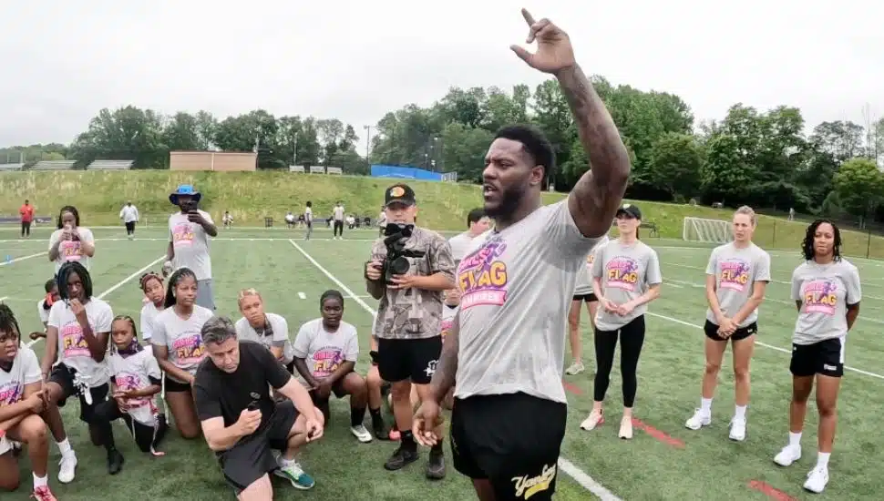 Zaire Franklin addresses athletes at La Salle College High School's flag football event.