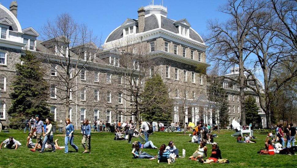 The Swarthmore College campus with students resting on the lawn.