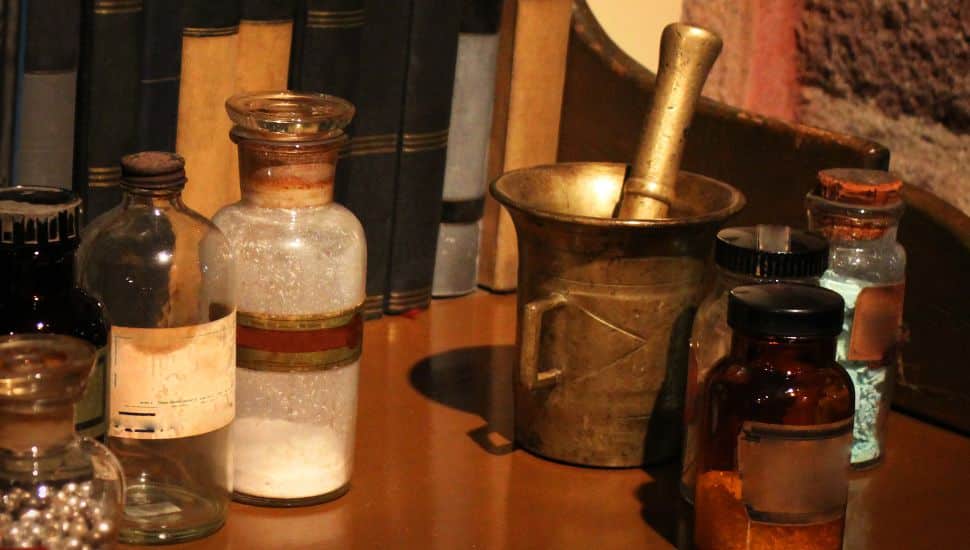 Older pharmaceutical jars and grinders.