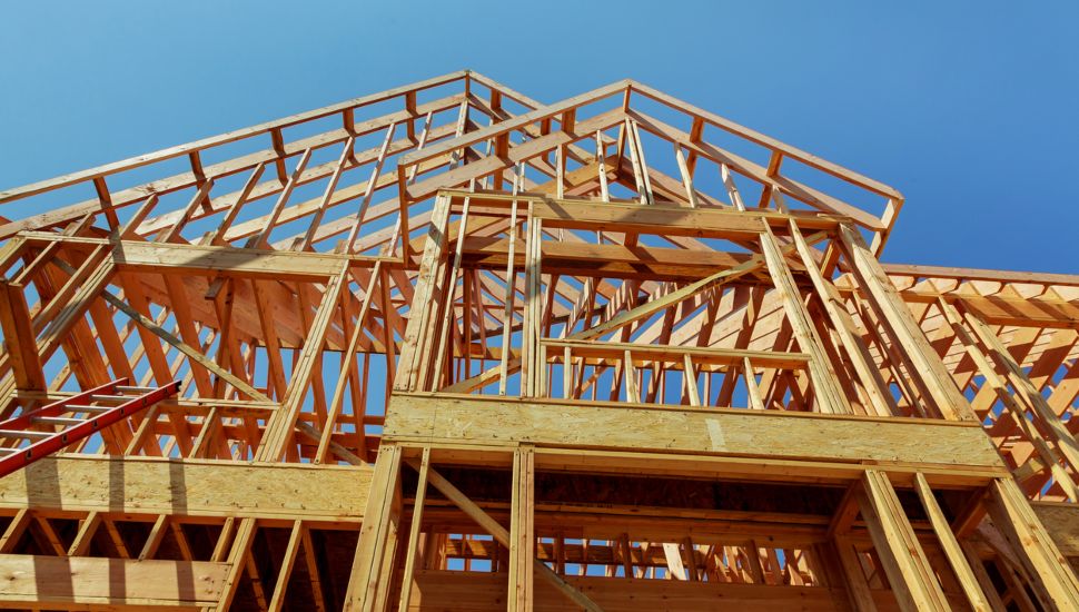 Wood framework of new residential home under construction.