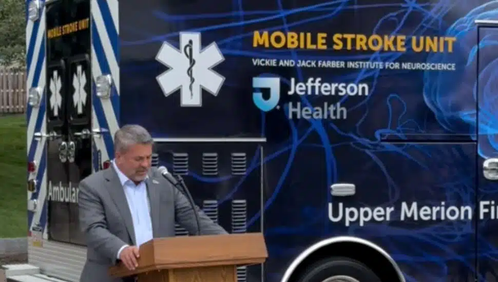 Jefferson Health CEO Dr. Joseph Cacchione is speaking in front of the new Mobile Stroke Unit.