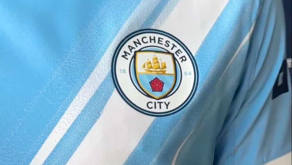 A blue soccer kit with the Manchester City patch.