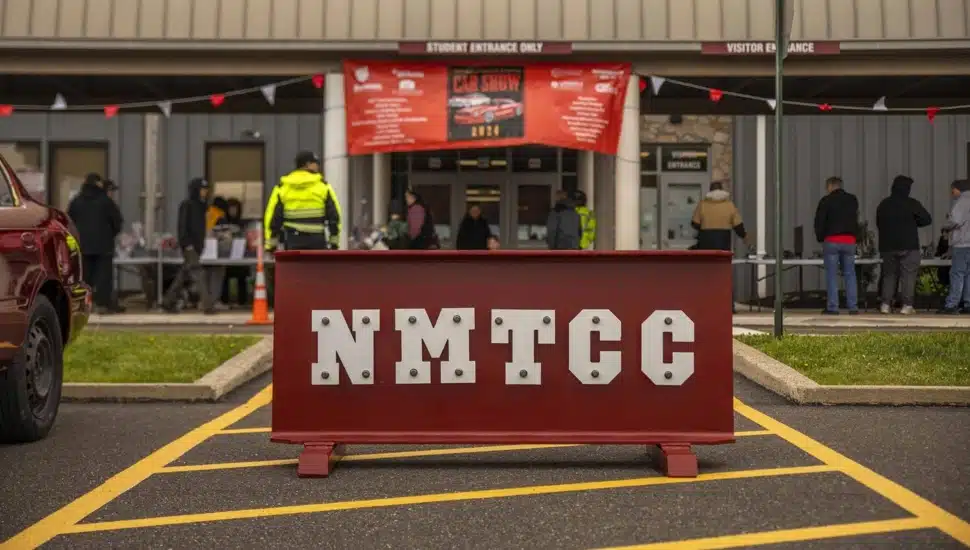 Entrance to technical career center with signage on steel beam.