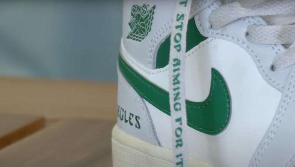 A closeup of the kelly green-custom Air Jordans for Saquon Barkley.