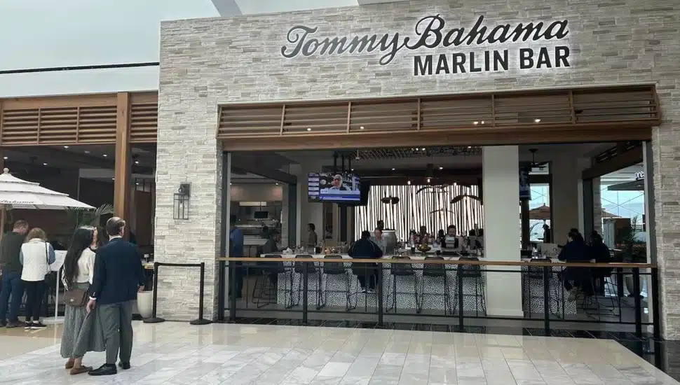 Exterior view of bar and grill inside a mall.