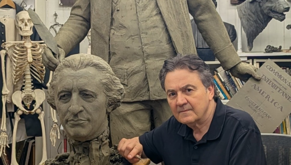 Glenside's Zenos Frudakis stands with a bust of one of his latest sculptures.
