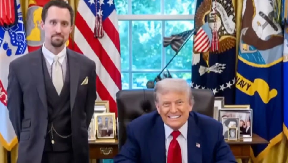 Dr. Erwin Antoni stands next to Donald Trump at his desk in the Oval Office.