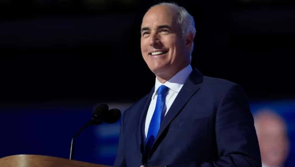 Bob Casey smiling at a podium.