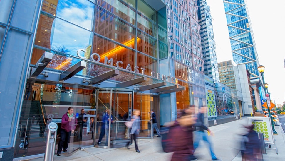People walking in and out of the Comcast building in Center City.