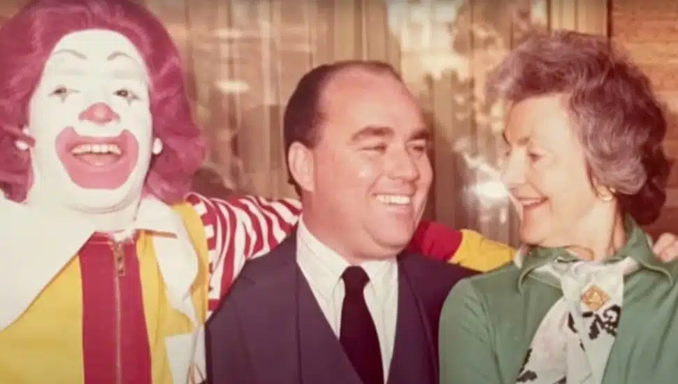 Jim Murray poses with his wife Dianne and Ronald McDonald.