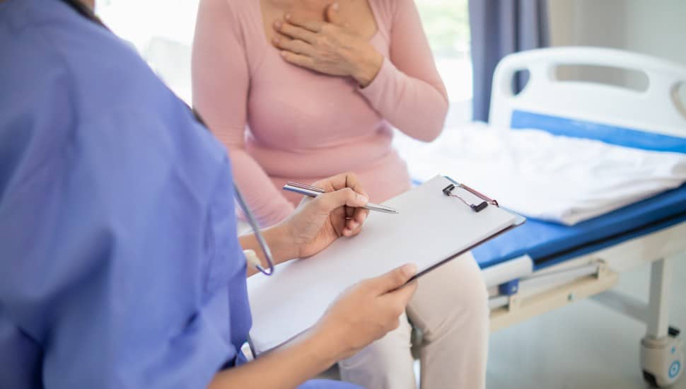 An elderly woman undergoes an annual health examination.
