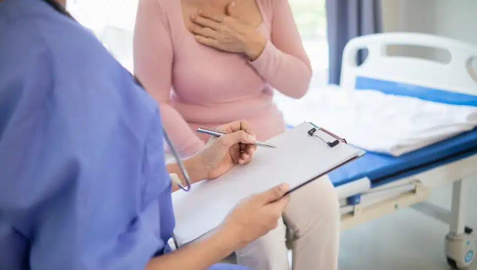An elderly woman undergoes an annual health examination.