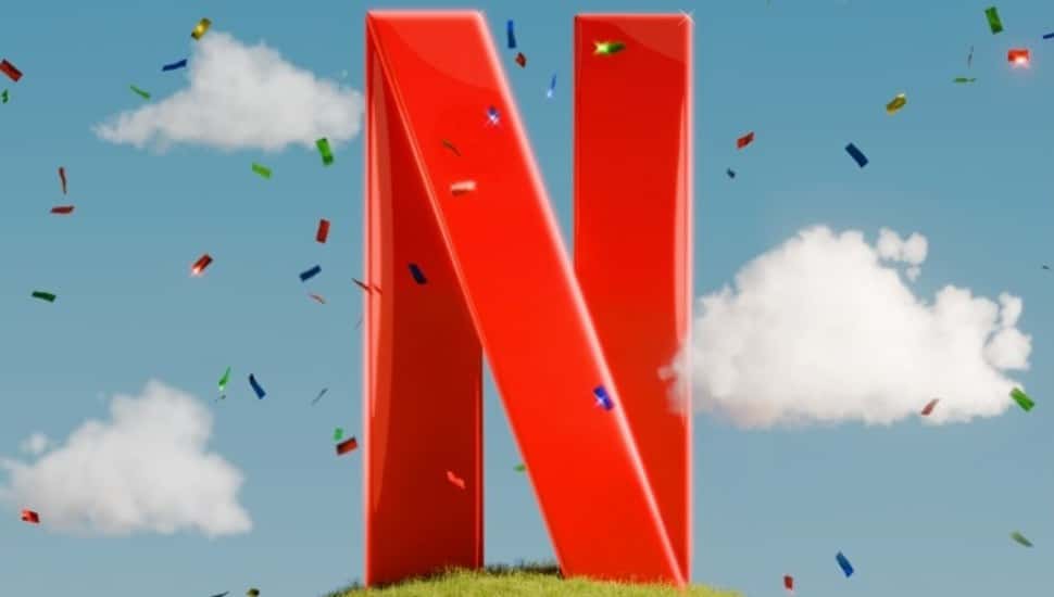 The Netflix 'N' on a green hill surrounded by confetti.
