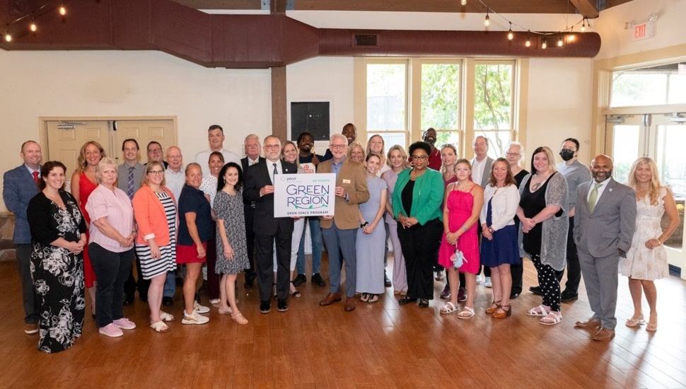 Group of nonprofit representatives pose for photo at awards ceremony.