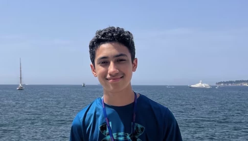 Glenmoore teen Phillip Diaz in front of the ocean and blue sky.