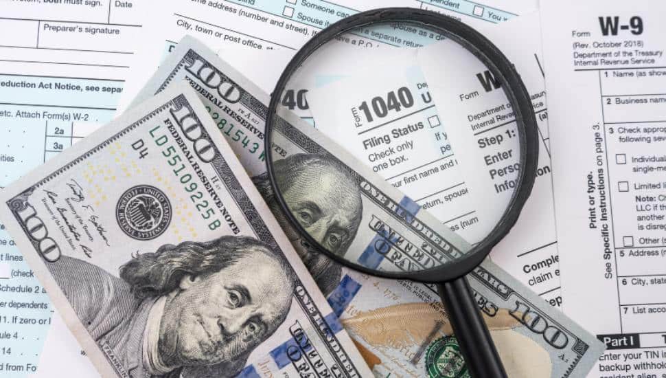 Tax declaration of citizens and one hundred dollar bills