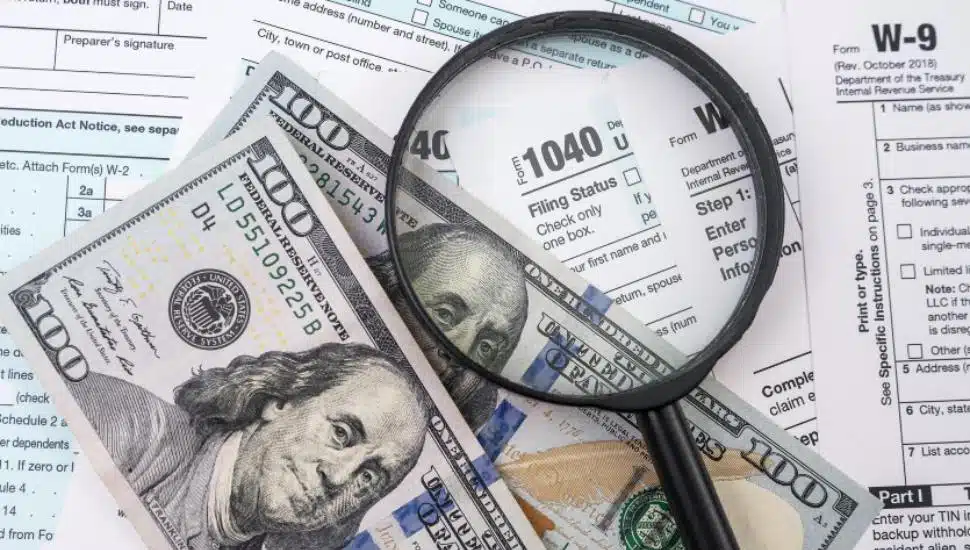 Tax declaration of citizens and one hundred dollar bills