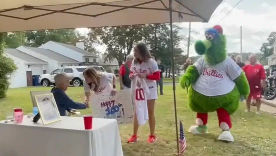 The Phillie Phanatic celebrates with Bobby Shantz on his 100th birthday.