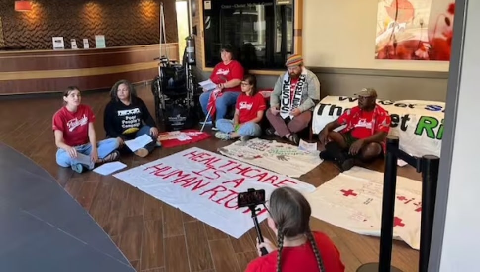 Protesters with the advocacy group Put People First PA! staged a sit-in at Crozer-Chester Medical Center Monday.