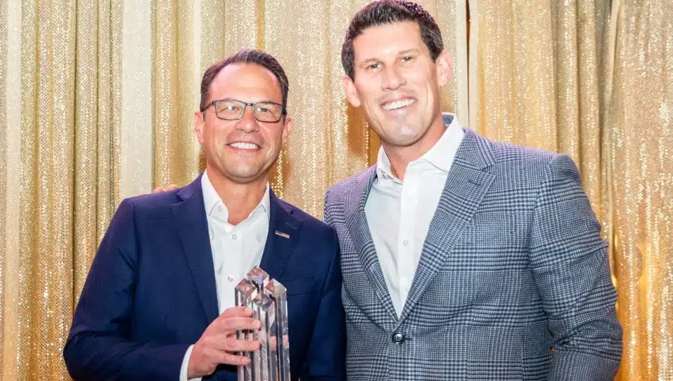 Josh Shapiro holding award next to Geoff Gross.