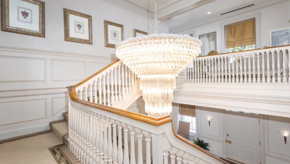 A chandelier hangs in the stairwell of Harold Katz's estate.