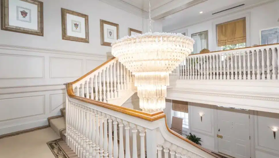 A chandelier hangs in the stairwell of Harold Katz's estate.