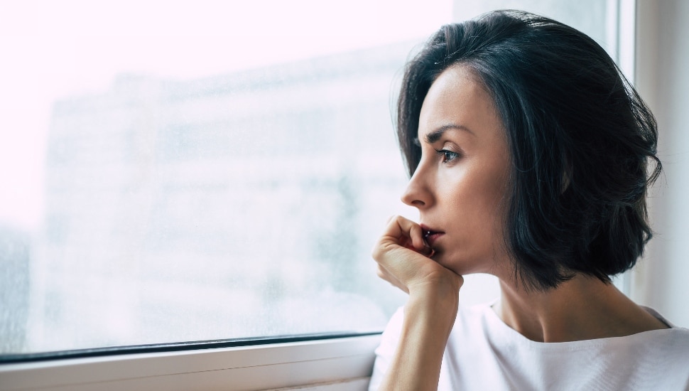 Reflective woman in a window