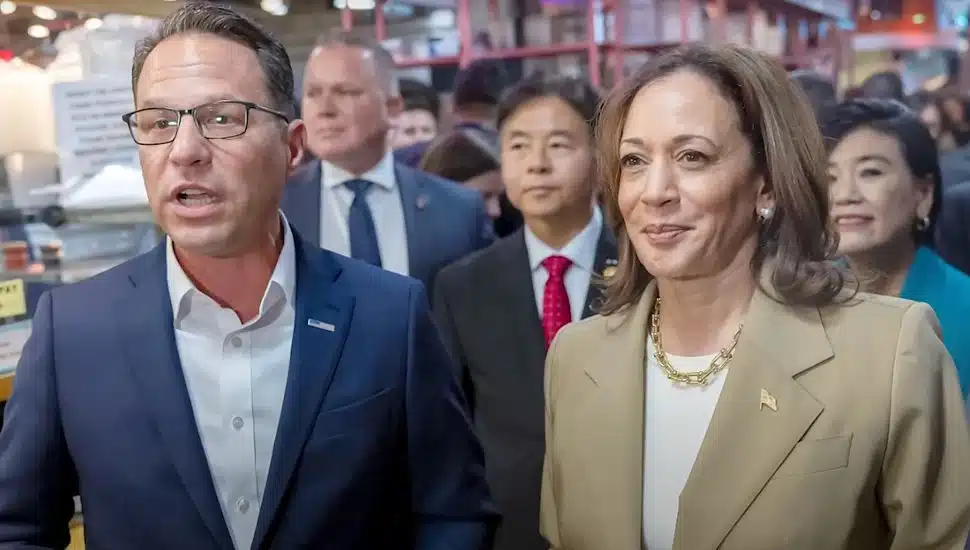 Josh Shapiro stands next to Kamala Harris.