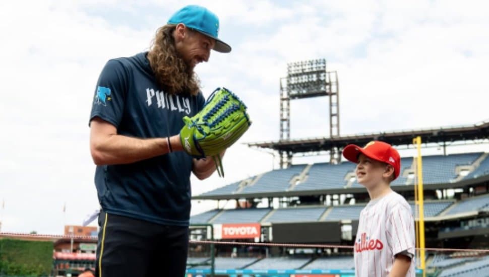 Matt Strahm wears green glove at Citizens Bank Park.