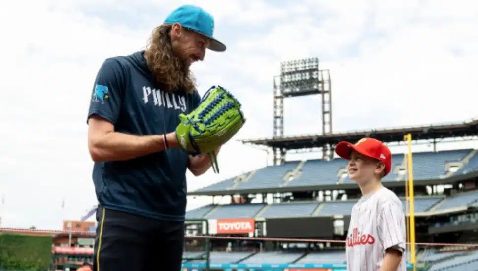 Matt Strahm wears green glove at Citizens Bank Park.