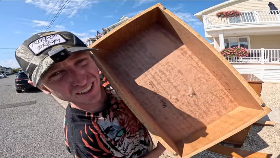 Tucker Upper holding a drawer he found.