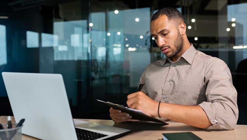 Business owner checks his finances online.