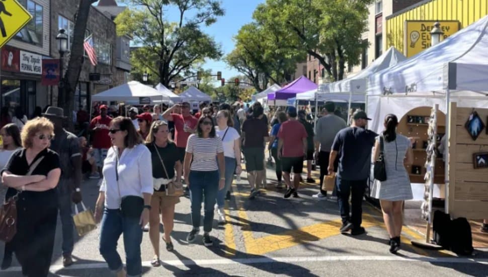 Locals walk the streets of Ambler's Oktoberfest.