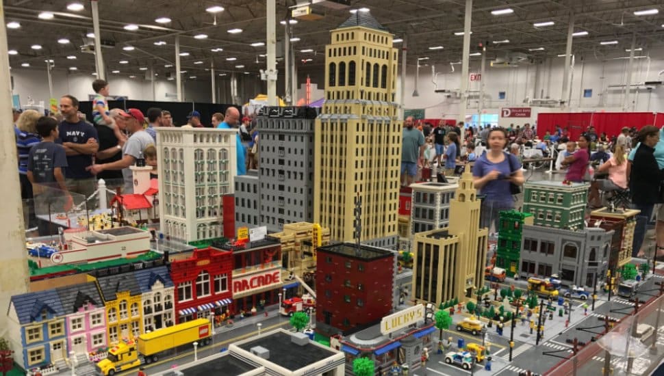 Visitors check out a city landscape made of LEGO bricks at BrickFair.