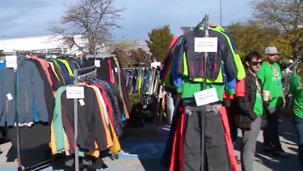 Racks of gently used winter clothes on racks at Buckman's tent sale.