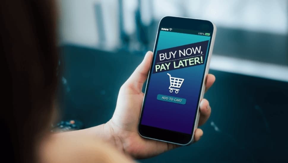 Person holds phone with Buy Now, Pay Later on screen.