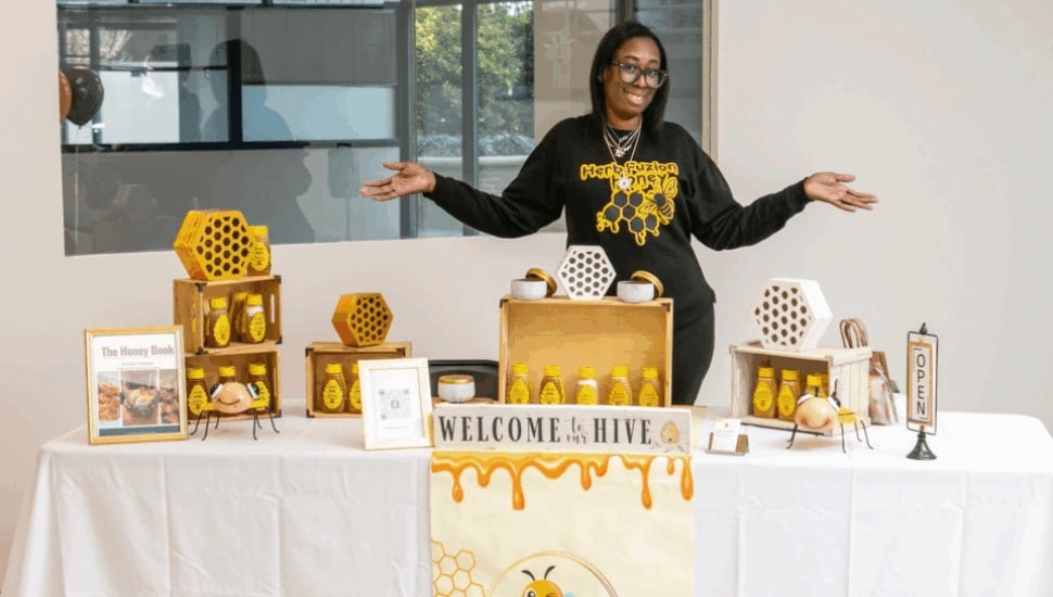 Herb Fuzion Handcrafted Honey owner Lanise Middleton with her products.