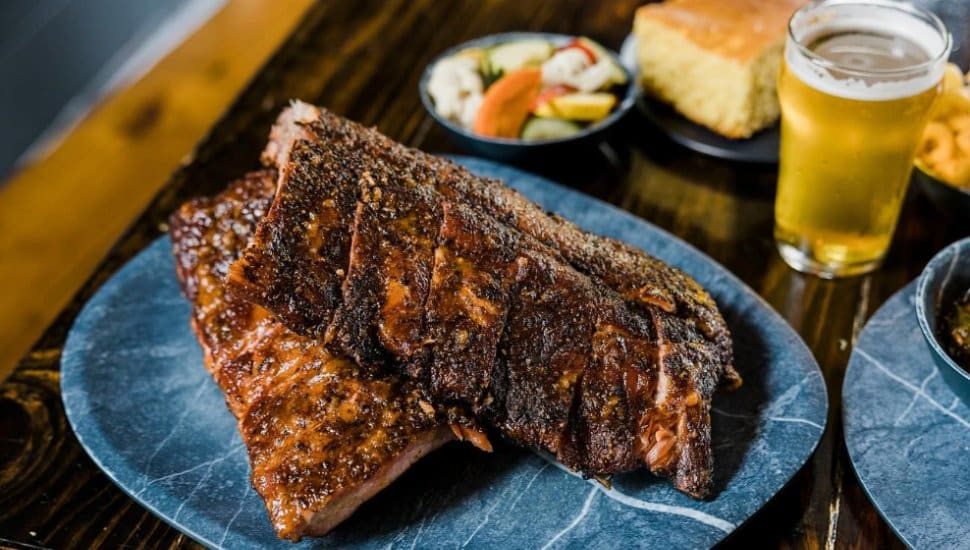 A plate of ribs and a beer at Bryn Mawr's La Cabra Brewing Smokehouse.